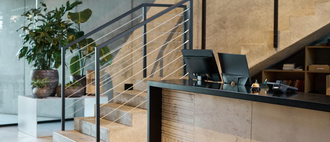 Modern Office Interior with Staircase and Potted Plants